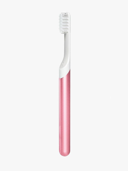 Quip Sonic Toothbrush in pink on gray background