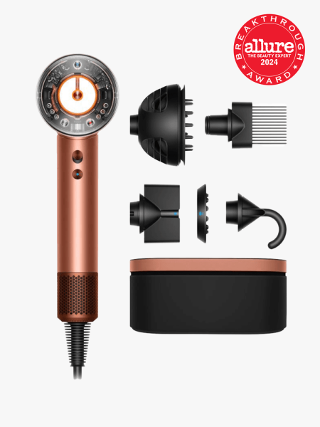 The Dyson Supersonic Nural Hair Dryer in Amber Silk with a red 2024 Allure Best of Beauty Breakthrough Award seal